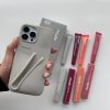 کاور گوشی موبایل آیفون 13، 14، 15 پرو iPhone13Pro- iPhone14Pro- iPhone15Pro- طرح رود rhode رنگ طوسی Gray همراه با لیپ گلاس Lip Gloss رژلب رنگ رندوم